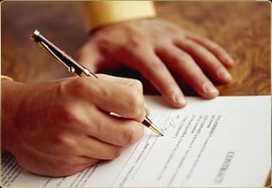 Signing a Mortgage Document